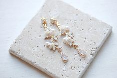 Pearl Bridal Earrings, Bridal Jewelry, Floral Wedding Earrings, Long Earrings for Bride, Gold Earrings, White Opal Earrings, Boho Earrings - Etsy White Dainty Crystal Earrings For Wedding, Dainty White Crystal Earrings For Wedding, Dainty White Crystal Wedding Earrings, Bride Gold Earrings, Elegant Gold Bridal Earrings With 3d Flowers, White Bridal Dangle Earrings With 3d Flowers, Elegant 14k Gold-filled Bridal Earrings, Delicate White Flower-shaped Bridal Earrings, White 14k Gold-filled Pearl Earrings For Wedding