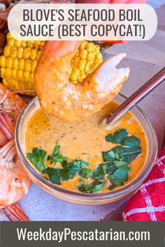 a bowl filled with shrimp and corn on the cob