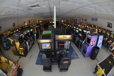 a room filled with lots of different types of video game machines and arcade gaming equipment