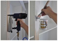 a person using a paint sprayer on the side of a wall and holding a hammer