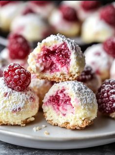 some raspberry filled pastries on a white plate