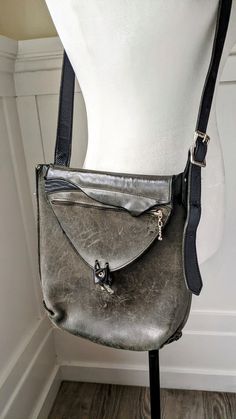 "Unique vintage distressed leather messenger bag, labeled \"Hammer\". Adjustable shoulder strap, silver metal hardware. 11\" x 10\" 2\"" Vintage Leather Shoulder Bag With Gunmetal Hardware, Vintage Shoulder Bag With Gunmetal Hardware For Daily Use, Vintage Leather Bags With Gunmetal Hardware, Vintage Travel Shoulder Bag With Silver-tone Hardware, Vintage Shoulder Bag With Silver-tone Hardware For Travel, Vintage Shoulder Bag For Travel With Silver-tone Hardware, Vintage Satchel With Silver-tone Hardware, Silver Leather Shoulder Bag With Hardware, Vintage Satchel Shoulder Bag With Gunmetal Hardware