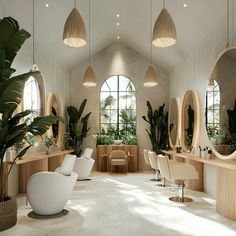 the interior of a modern salon with large mirrors and plants in vases on the tables