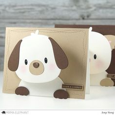 two cards with dogs on them, one is brown and the other has white paper