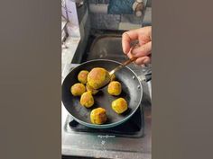 a person is frying some food in a pan