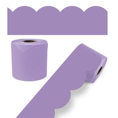 a roll of purple paper next to a roll of toilet paper