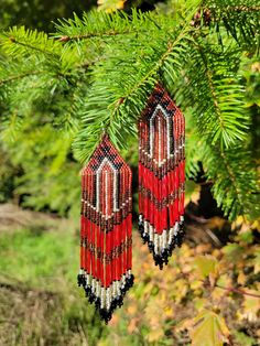 Beautiful beaded earrings Native inspired. A sure head turner with these beautiful colors. Made with delica beads in a brick stitch pattern. Red, silver, and black. A unique gift for a special person....or keep for your own collection.  https://shelbyswolfvisions.etsy.com Native Beaded Earrings, Beautiful Beaded Earring, Native Beading, Native Beading Patterns, Beaded Earrings Native, Brick Stitch Pattern, Delica Beads, Brick Stitch, Special Person