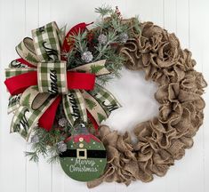 a christmas wreath hanging on the side of a wall