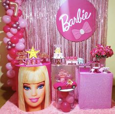 a barbie birthday party with pink decorations and balloons