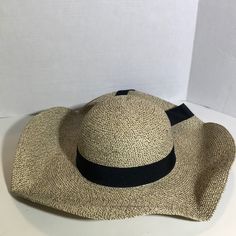 This Hat Is Brand New With Tags And Has Never Been Worn. This Floppy Straw Beach Hat Is Black And Cream. It Has A Wide Brim And A Black Bow. It Has 50+ Upf Protection And Comes With A Removable Cord. This Hat Is A Large And The Material Is 60% Paper, 20% Cotton And 20% Polyester. Message Me With Questions! Chic Cream Hat For Vacation, Beige Floppy Sun Hat For Vacation, Cream Wide Brim Hat For Vacation, Trendy Cream Wide Brim Sun Hat, Beige Floppy Sun Hat For Beach Season, Beige Floppy Sun Hat For The Beach, Beige Floppy Sun Hat For Beach, Chic Sun Hat For Beach Season Travel, Cream Straw Hat For Beach Day Out