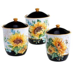 three sunflower canisters with lids on them