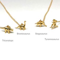 "★ Adorable dinosaur charm pendant 14k gold filled chain necklace. Nice Christmas gift for dino lovers and animal lovers! Customize your order by choosing from one to four dinosaurs on one necklace.  Listing is for one dinosaur necklace.  Choose dinosaur charm pendant: Tyrannosaurus, Brontosaurus, Triceratops, or Stegosaurus If choosing more than one dinosaur, in the personalization box below, enter the names of the dino charms you want in the order you'd like them on the necklace. D E T A I L S - 14k gold-filled delicate link necklace.  - 14k gold plated dinosaur charm pendant (brass material) * Charm pendant Measurement : ~ 17mm(w) x 11mm(h) LENGTH  - Please select from the drop-down selection. Choose 16\", 18\" or 20\". - An adjuster chain with large sized-links (approximately 1.5 inche Moana Necklace, Paua Shell Jewelry, Dinosaur Necklace, Formal Jewelry, Turquoise Pendant Necklace, Funky Earrings, Gold Chain Jewelry, Charm Pendant Necklace, Cool Necklaces