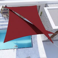 an overhead view of a house with a red awning over the pool and patio area