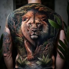 the back of a man's body with a lion tattoo on his shoulder and chest