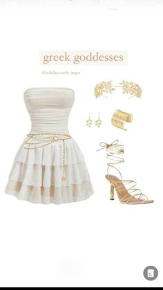 a white dress with gold accessories and heels on it's side, next to a pair of high heeled sandals