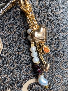 This piece of jewelry can be used as a bag charm, a keychain, or a decoration for any other item.  * Gold: Brass/copper/St.steel + 18K Gold plated * Platinum: Brass/copper/St.steel + Rhodium plated * Freshwater &  Baroque pearls; Natural Garnet/Aventurine stones; Zircon pendant * No risk of allergy (nickel-free, lead-free, cadmium-free) * Full length: 95 mm * The shape and color of the stones and pearls may vary * Delivered with a cleaning cloth and a ready-to-gift jewelry storage pouch * FREE U Watermelon Keychain, Fruit Keychain, Pearl Keychain, Pomegranate Jewelry, Aventurine Stone, Pearl Bag, Gold Bag, Jewelry Pearl, Bag Charms