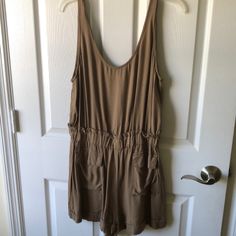 One Piece Shorts Romper With Pockets Elastic Around The Waist Brand New Never Worn Summer Short Jumpsuits And Rompers With Pockets, Casual Short Jumpsuits And Rompers, Khaki Jumpsuits And Rompers For Summer Loungewear, Khaki Jumpsuits And Rompers For Summer Day Out, One Piece Shorts, Lulus Jumpsuit, Free People Jumpsuit, Chambray Romper, Boho Jumpsuit