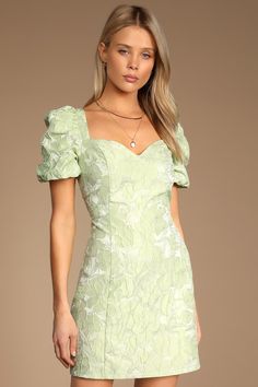 The Lulus Beyond Amazing Light Green Floral Jacquard Puff Sleeve Dress is next-level chicness! Woven jacquard fabric, with a textured floral design throughout, shapes this dress that has a sweetheart neckline and puffy short sleeves. The princess-seamed bodice carries into an A-line mini skirt. Hidden back zipper/clasp. Fit: This garment fits true to size. Length: Mid-thigh. Size medium measures 33" from top to bottom. Bust: Great for any cup size. Waist: Fitted - very fitted at natural waist. H Light Green Hoco Dress, Green Hoco Dress, Modest Homecoming Dresses, Short Green Dress, Floral Dress Outfits, Light Green Dress, Recruitment Outfits, Cute Floral Dresses, Green Homecoming Dresses