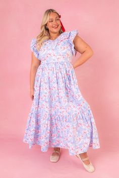 Introducing the Marjorie Dress, the epitome of summer chic! Dive into a sea of whimsical blue, white, & red butterfly prints, on a soft cotton fabric. Its neckline is surrounded by a cascade of ruffles, perfectly complementing the flutter sleeves. But wait, there's more! The maxi-length tiered skirt not only flatters every figure but also has pockets! The best dresses always do! Prepare to turn heads and steal hearts this summer in the Marjorie Dress! Don't forget the matching mini styles! Blue Summer Dresses With Butterfly Print, Blue Sleeveless Dress With Butterfly Print, Blue Butterfly Print Casual Dress, Light Blue Cotton Midi Dress With Ruffles, Feminine Blue Cotton Midi Dress, Blue Cotton Midi Dress In Feminine Style, Blue Cotton Midi Dress With Feminine Style, Blue Cotton Midi Dress Feminine Style, Butterfly Prints