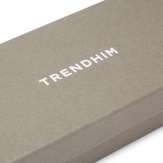 a box with the word trendhim printed on it's side, in front of a white background