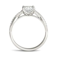 a white gold engagement ring with a princess cut diamond center and pave set shoulders