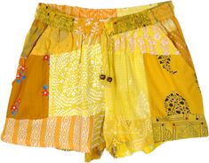 The warm yellow hues add subtle fun to your wardrobe this season with these sustainable, comfy, and unique shorts.  The shorts comprise multiple pieces of recycled or leftover fabric sewn together. #tlb #JuniorPetite #beachwrap #Indian #Handmade #HippieShorts #BeachShorts #PatchworkShorts Casual Patchwork Shorts, Casual Yellow Patchwork Bottoms, Casual Yellow Cotton Shorts, Yellow Patchwork Bottoms For Spring, Spring Yellow Bottoms With Patchwork, Spring Yellow Patchwork Bottoms, Yellow Cotton Shorts With Pockets, Mustard Cotton Shorts, Mustard Cotton Beach Bottoms