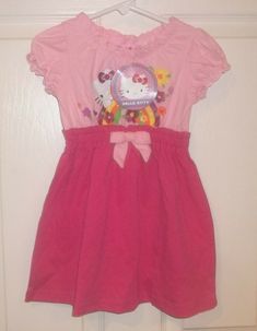 Baby Girls Precious HELLO KITTY DRESS! Brand new with tags attached! Size 24 Months Cute as can be baby girl's adorable pink Hello Kity dress is brand new with tags. Size 24 Months. Sweet one piece dress is light pink on top bodice and bright fuchsia pink attached skirt. Top bodice features a brightly colored, glittery Hello Kitty design. Ruffled elastic around top neckline, sleeves, and waistband. Adorable bow at front center waist. Short sleeves. 100% cotton. New with tags attached. Delightful Hello Kitty Print Fitted Dress For Spring, Spring Hello Kitty Print Cute Dress, Spring Cute Hello Kitty Print Dress, Cute Hello Kitty Print Spring Dress, Hello Kitty Print Cute Spring Dress, Spring Cotton Dress With Hello Kitty Print, Fitted Pink Hello Kitty Dress, Cute Pink Hello Kitty Print Dress, Cute Pink Hello Kitty Dress