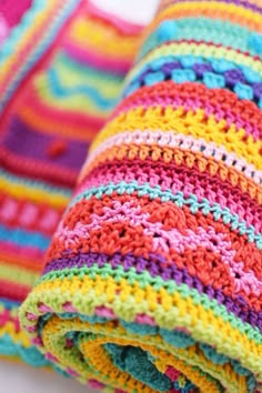 multicolored crocheted blanket folded on top of each other