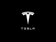 the tesla logo on a black background