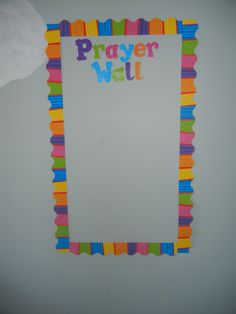 a paper wall with the word prayer written on it