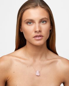 A soft and translucent tender pink stone, custom hand set in 14 karat gold and diamonds. Adorned back to and adjustable Italian gold chain. Made in New York City. · 14 karat yellow gold, 2.6 grams · Rose Quartz, 60 carats · Height: 25mm · Length: 26mm · Width: 12mm · 17 Diamonds, 0.41 carat · 16 to 18 inches length · Handmade in NYC · Style # JJ-NCK-006-YG · UPC 850021669133 Delicate Pink Gemstone Crystal Necklace, Formal Pink Rose Quartz Jewelry, Pink Wedding Necklace With Adjustable Chain, Pink Necklace With Adjustable Chain For Wedding, Elegant Pink Rose Quartz Crystal Necklace, Feminine Oval Pink Jewelry, Delicate Pink Rose Quartz Necklace, Pink Necklaces With Adjustable Chain For Weddings, Pink Oval Feminine Jewelry