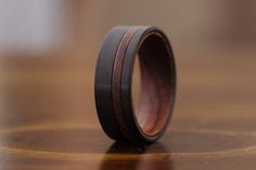 a wooden ring sitting on top of a table