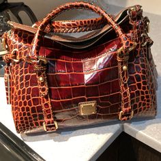 Dooney And Bourke Embossed Crocodile Small Satchel In Cognac Color. New Condition. Comes With Dust Bag. This Is A Brand New Bag. Luxury Elegant Michael Kors Bucket Bag, Elegant Michael Kors Luxury Bucket Bag, Michael Kors Joan Handbag, Crocodile Purse Handbags, Italian Purses, Crocodile Handbags, Luxury Tote Bags, Patent Leather Handbags, Cognac Color