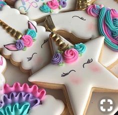 decorated cookies in the shape of unicorns and stars