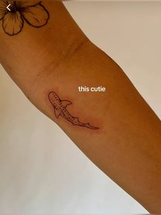 a person with a tattoo on their arm that says, this outline is alligator tooth