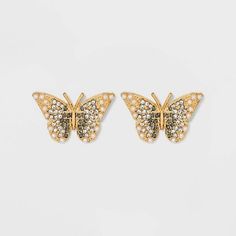 Add a little nature to every ensemble this season with the SUGARFIX by BaubleBar Crystal Wings Butterfly Stud Earrings. This pair of stud earrings features stunning gold and sparkling crystal crafted into two beautiful butterflies. Pair these with either tousled strands or a sleek updo in order to elevate every casual outfit. Crystal Wings, Wings Butterfly, Apple Earrings, Disney Earrings, Minnie Mouse Earrings, Baublebar Earrings, Sleek Updo, Butterfly Stud Earrings, Black Earrings Dangle