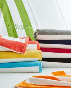 towels stacked on top of each other in different colors