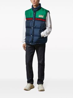 Padded vest by GUCCI in blue and green characterized by logo patch, sleeveless, button closure and drawstring waist. This item is in size 48 and the color is Gucci Outerwear With Pockets For Streetwear, Gucci Cotton Outerwear With Pockets, Gucci Sporty Streetwear Outerwear, Gucci Sporty Outerwear For Streetwear, Sporty Gucci Outerwear For Streetwear, Casual Green Vest Outerwear, Gucci Casual Cotton Outerwear, Casual Gucci Cotton Outerwear, Blue Sporty Sleeveless Outerwear