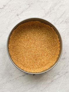 a metal pan filled with food on top of a white counter