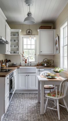 the kitchen is clean and ready to be used for cooking or baking, while also being used as a dining area