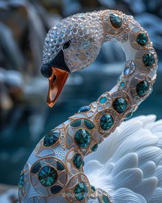 a close up of a white swan with green jewels on it's head and neck