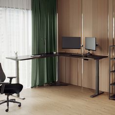 a desk with two computer monitors and a chair in front of a curtained window