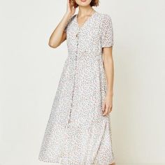 Floral Button-Down Midi Dress Lightweight Floral Print V-Cut Neckline Button Down Closure Elastic Puff Sleeves Fitted Smock Waistline Dress Fully Lined Chic Buttoned Maxi Dress For Garden Party, V-neck Midi Dress With Buttons For Garden Party, Casual Buttoned Dresses For Garden Party, Knee-length Button Dress For Garden Party, Spring Buttons Maxi Dress For Brunch, Feminine Button-up Dresses With Buttons, Spring Maxi Dress With Button Closure For Brunch, Spring Brunch Maxi Dress With Buttons, Spring Brunch Maxi Dress With Button Closure