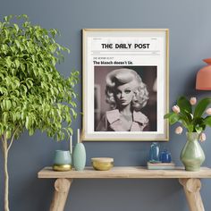 the daily post is displayed in front of a table with vases and potted plants