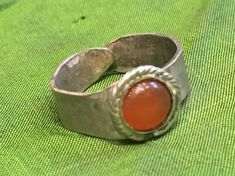 This beautiful ring is replica of Roman ring. Ring made of sterling silver with carnelian cabochon. This ring is rare example of adjustable Roman ring and will fit most of the sizes. It easy to adjust. If you want me to adjust it to your specific size just tell me your ring size (or finger circumference) and I send it adjusted. If you are looking for ring that will fit with your or someone else SCA or living history garb - this ring is exactly what you need. Besides it perfect for all sort of me Vintage Silver Carnelian Rings, Silver Carnelian Ring Stamped 925, Silver Carnelian Ring As A Gift, Silver Carnelian Ring Jewelry, Silver Carnelian Rings Spiritual Style, Silver Carnelian Rings For Gift, Silver Carnelian Spiritual Ring, Unique Silver Carnelian Rings, Adjustable Silver Carnelian Rings