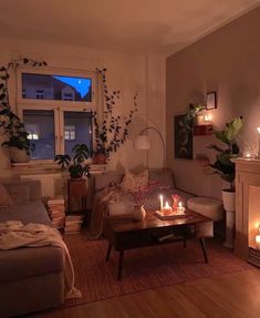 a living room filled with furniture next to a fire place in front of a window