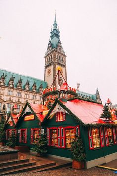 an old building with christmas decorations on the roof