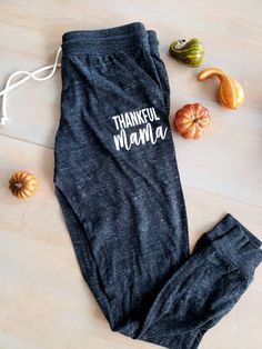 Thankful Mama Joggers They are super soft and comfortable Ribbed cuff Natural draw string to adjust size Made 30 percent cotton 50 percent polyester 20 percent raylon Womens sizing Washing instrustions Wash on cold and inside out dry on delicate. Available in Camo and Eco Black Fall Letter Print Relaxed Fit Bottoms, Fall Full-length Joggers With Elastic Waistband, Fall Full Length Joggers With Elastic Waistband, Letter Print Long Pants, Winter Letter Print Pants, Stretch Cotton Pants With Letter Print, Stretch Pants With Letter Print For Winter, Fall Stretch Full-length Joggers, Fall Stretch Full Length Joggers