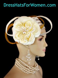 Ladies 1920's Style Flapper Art Deco Era Ivory Metallic Gold Pillbox Church Wedding Bridal Cocktail Hat. This Formal Straw Braid Hat Is Embellished With A Large Ivory Double Loop Bow Enhanced With Clear Acrylic Rhinestones, Accented With Two Metallic Gold Double Looped Bows. A Large Ivory Millinery Silk Flower With A Large Pearl Center Is Placed In The Center Of This Beautiful Custom Made Bow.  Four Rows Of Rhinestones Encircle The Crown Of This Fashion Wedding Headpiece. This Designer Hat Is Su Vintage White Headpiece For Kentucky Derby, Vintage White Wedding Costume Hats And Headpieces, White Vintage Headpiece For Formal Occasions, White Vintage Headpieces For Formal Occasions, Vintage White Costume Hats And Headpieces For Wedding, White Vintage Wedding Costume Hats And Headpieces, Vintage White Costume Hats For Wedding, Vintage White Formal Headpieces, Vintage White Fascinator For Evening