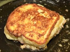 some food is cooking in a pan on top of the stove and it looks like they have been cooked